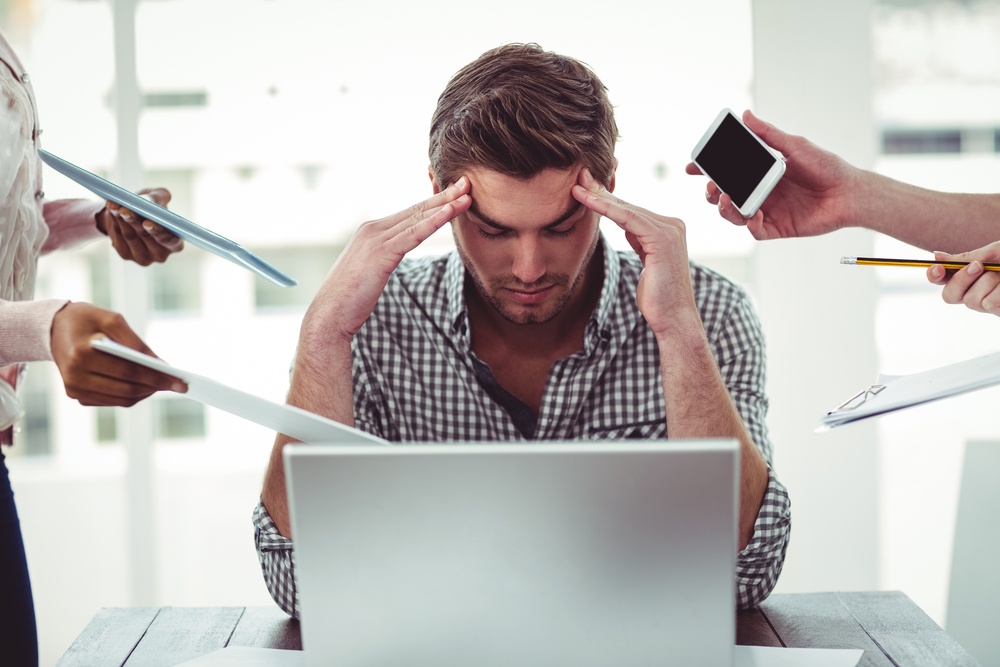 Businessman-stressed-out-at-work-in-casual-office-1-1 - What to Do When Top Performers Are Not Team Players