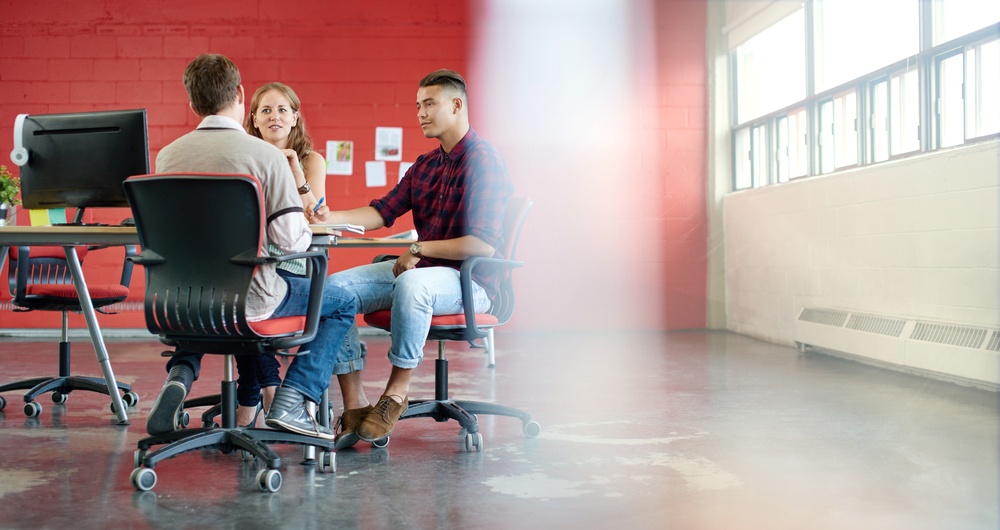 Unposed-group-of-creative-business-people-in-an-open-concept-office-brainstorming-their-next-project. - Building a Solid Selection Pipeline